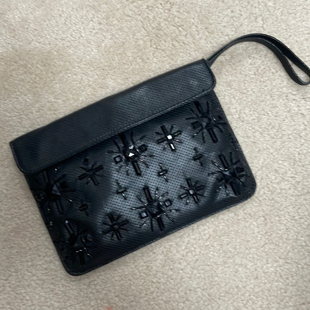Black clutch from Zara with jewels